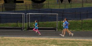 Running--B-CC High sports field in downtown Bethesda MD Runners on the B-CC field